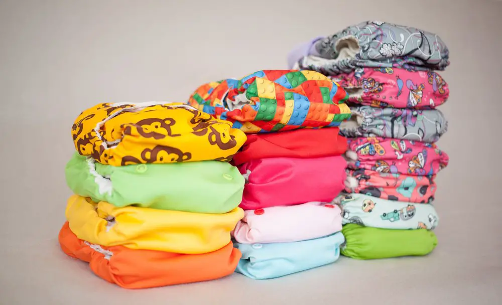 Stack of many cloth diapers, different colors