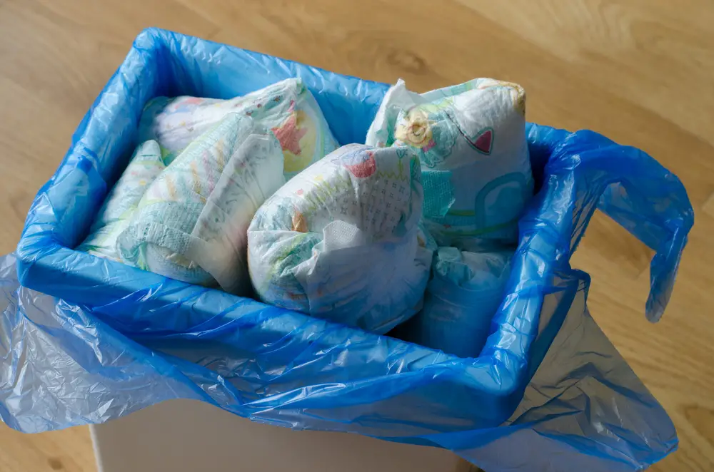 trash bin full of used diapers