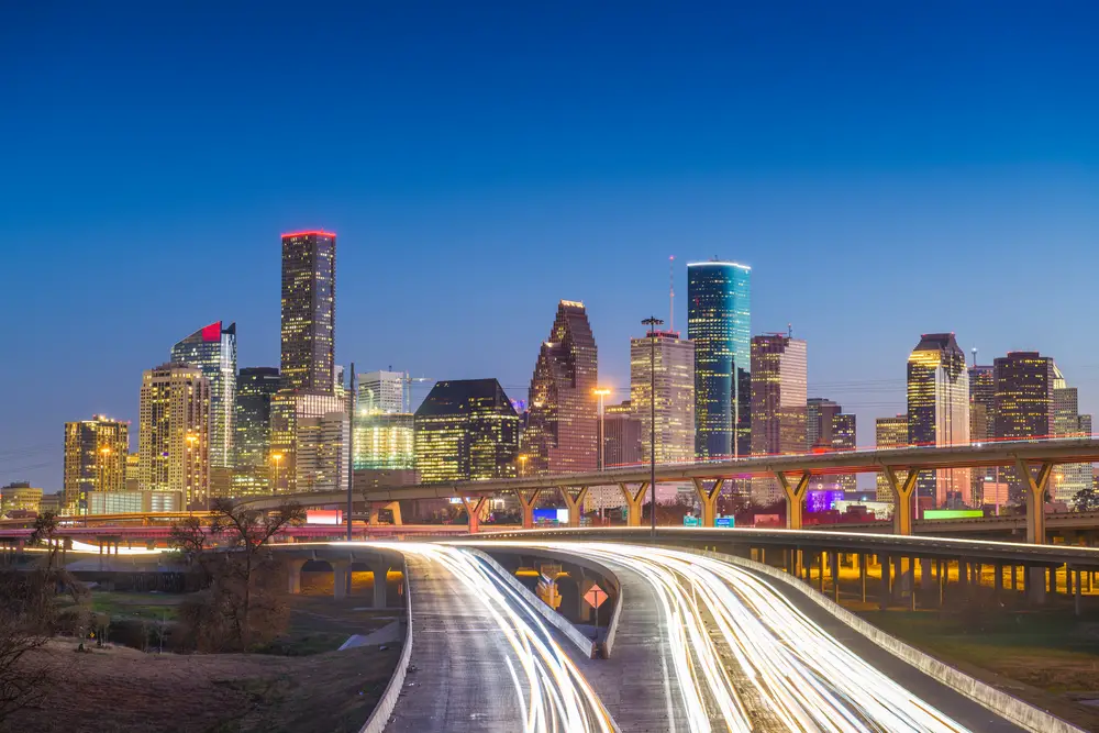Houston, Texas, USA downtown skyline over the highways at dusk.
